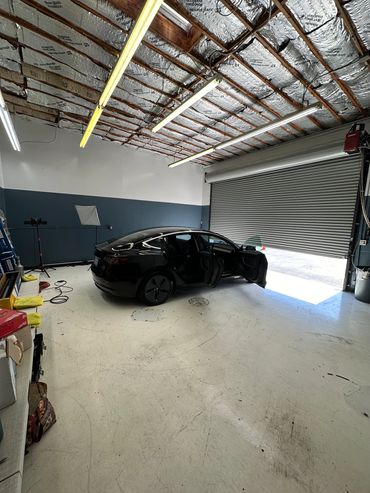 2023 Tesla Model 3 Tinted and parked inside the shop