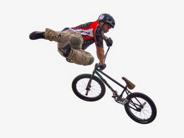 BMX rider mid-air performing a trick.