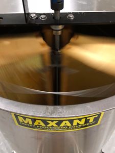 Extractor spinning uncapped frames of honey.