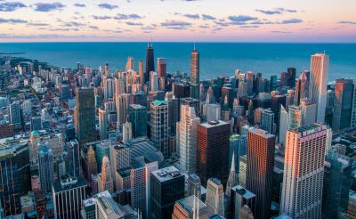 City skyline at sunset with skyscrapers.