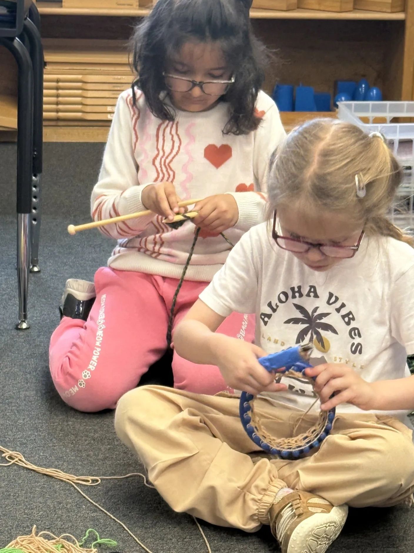 Two kids knitting and crafting.