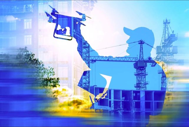 Silhouette of a person holding a drone overlapping with construction cranes.