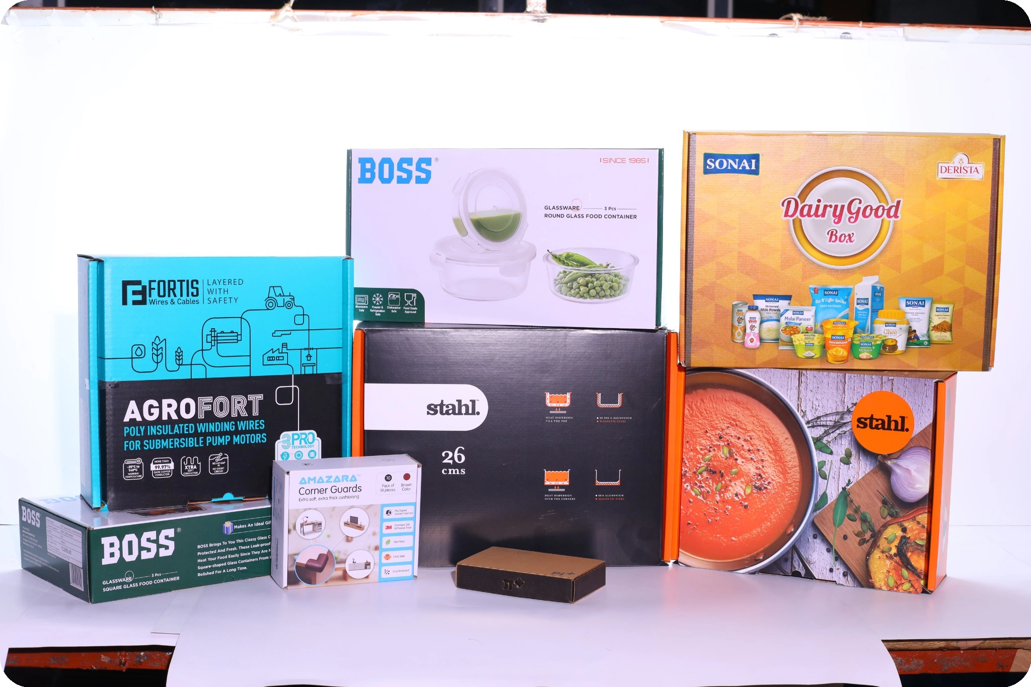 Stacked boxes of various household and industrial products against a white background.