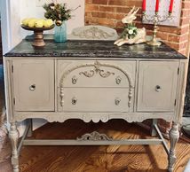 Antique buffet painted in Dixie Belle french linen chalk paint. Top stamped with Iron Orchid Designs
