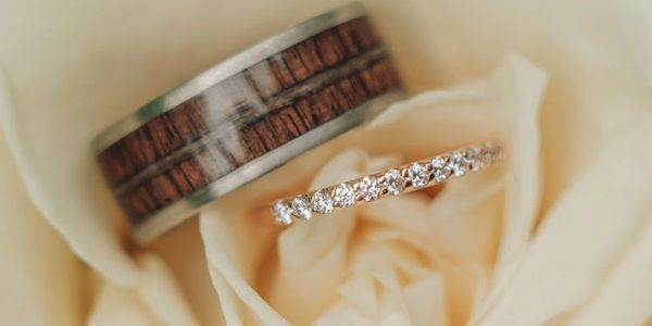 Wedding rings in a rose