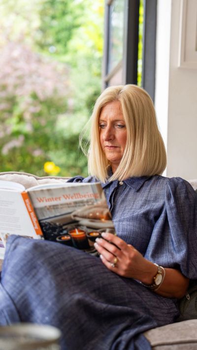 Vicky Braddock reading a wellbeing book