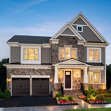 Dark gray two-story family home.