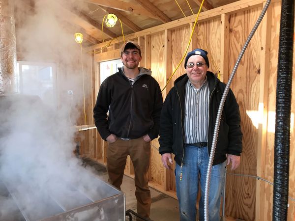 Processing team cooking down the sap into maple syrup.