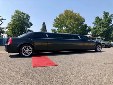 Red carpet rolled out in front of a limo ready to do a wine tour
