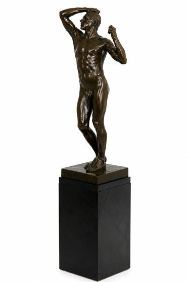 The Age of Bronze after Auguste Rodin, full standing male nude bronze figure on black pedestal