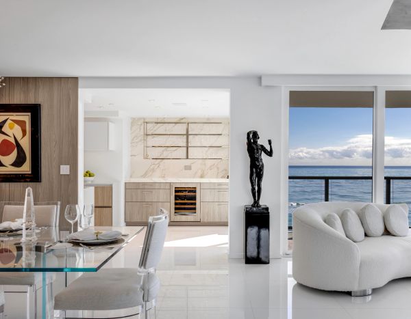 Bronze figurative sculpture displayed in an elegant contemporary waterfront residence, illustrating