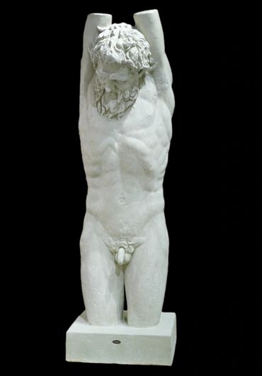 Ancient marble sculpture of a bearded man with arms raised, missing forearms and head bowed.