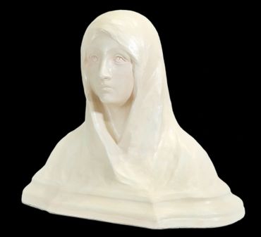 White marble bust of a woman wearing a veil with a solemn expression.