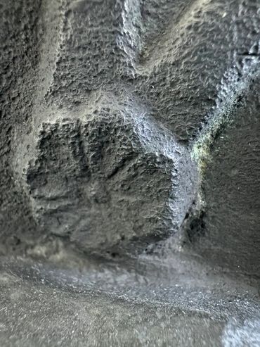 Rosette close up beneath right and left
sandal of life-size bronze Seated Mercury after the Villa d