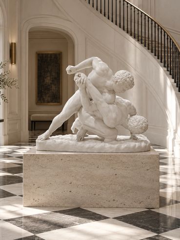 Interior visualization of The Wrestlers plaster cast in a grand foyer with curved staircase