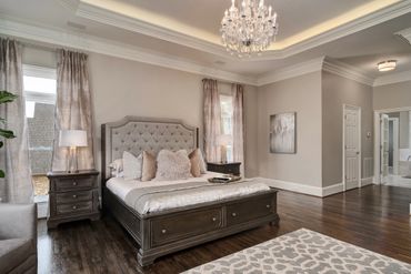 Primary Bedroom Suite with custom chandelier