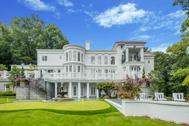 Exterior backyard paradise with two story entertaining areas