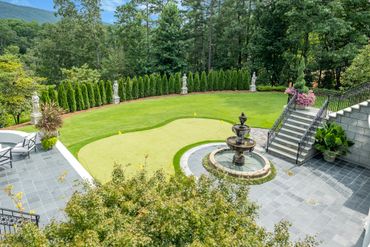 Water feature and luxury landscaping on grand estate property