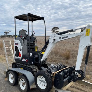 E17Z Excavator With 3 buckets and post hole digger available.