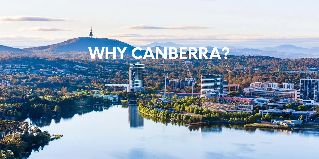 An aerial photo of the city of Canberra including the lake and Black Mountain
