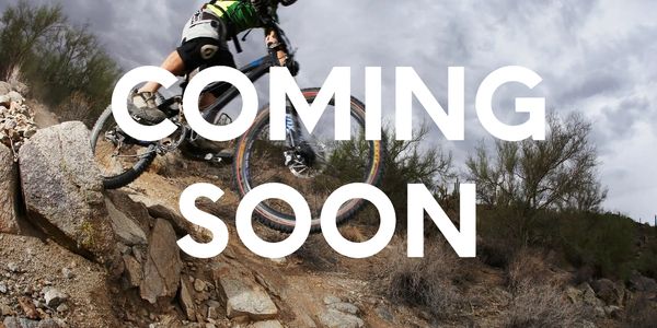 A mountain biker with the words 'coming soon' across the image