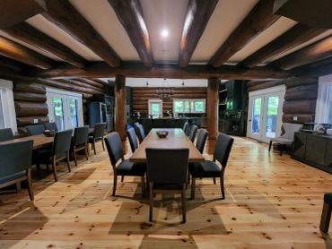 Restored interior beams at a Muskoka log home with professional media blasting and premium stain finish.