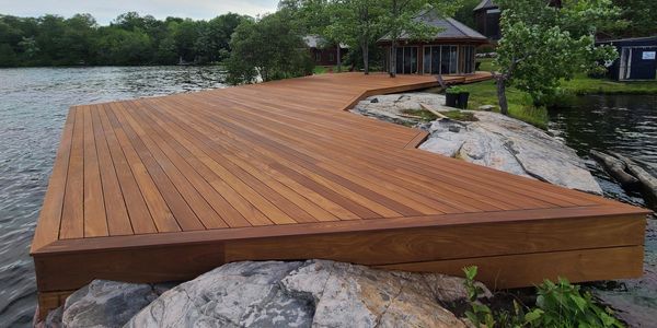 Wood dock restoration in Muskoka ON- power wash and stained with Sansin Stain.