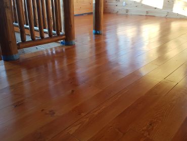 Restored wood floor in Simcoe County with professional wood restoration and refinishing services.