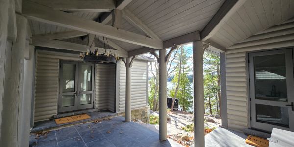 Exterior of log home- media blast, staining and painting of exterior logs, Sansin stain