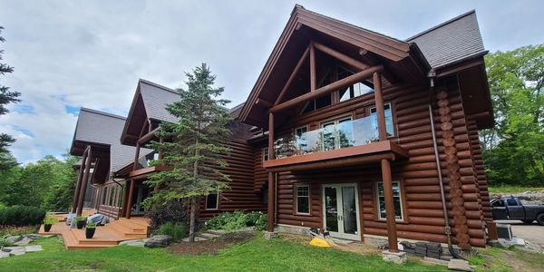 Log home restoration- stacked log home- media blasted and stained using Sansin Stain