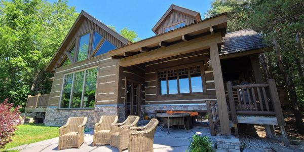Timber frame log home restoration- media blasted, stained with Sansin Stain and chinking completed.