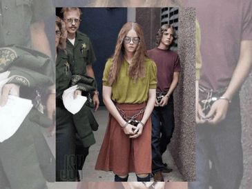 Woman in handcuffs escorted by officers during arrest.