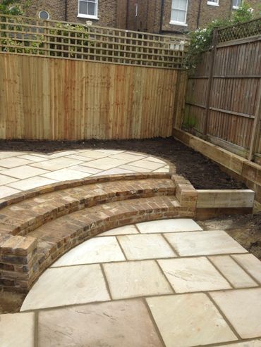 Garden design patio steps paving Indian sandstone patio brickwork lomdon stocks fencing featherboard