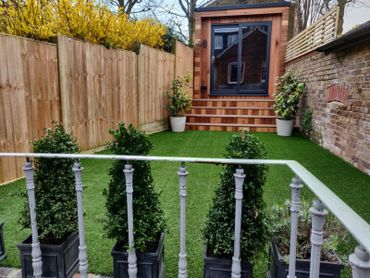 Garden room garden office cedar cabin decking millboard artificial grass fencing studio