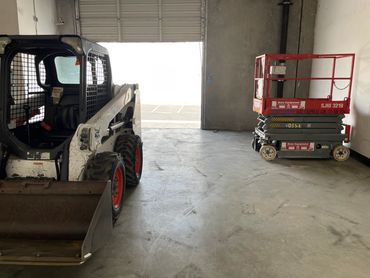 BobcatS650 & SJ19 scissor lift on a Demo Job in Commerce, Ca