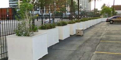 Large Line of Planters in a Parking Lot