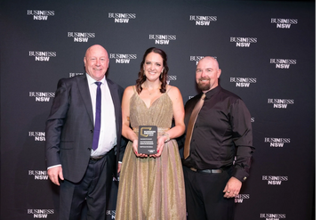 Darryll Weekes presenting Lauren and Matthew Kane their award