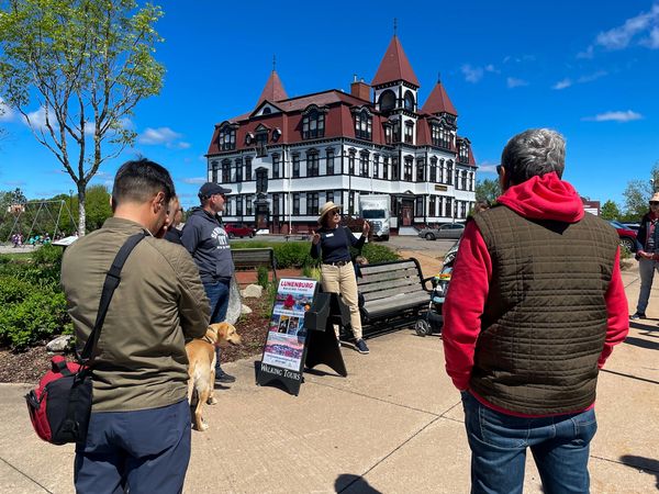 Lunenburg Walking Tour participants in front of the Lunenburg Academy near Lunenburg Hotels