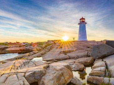 Nova Scotia's most famous attraction Peggy's Cove lighthouse at sunset
