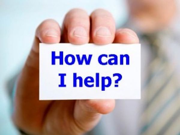 Image of hand holding a How can I help sign at River Ridge Lodge Mahone Bay Accommodations