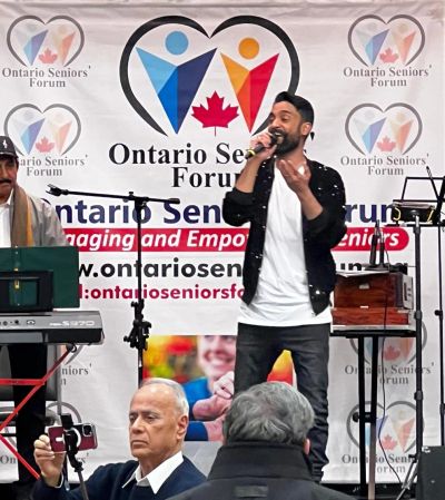 Performer singing at a Musical Night organized by Ontario Seniors’ Forum in Milton.