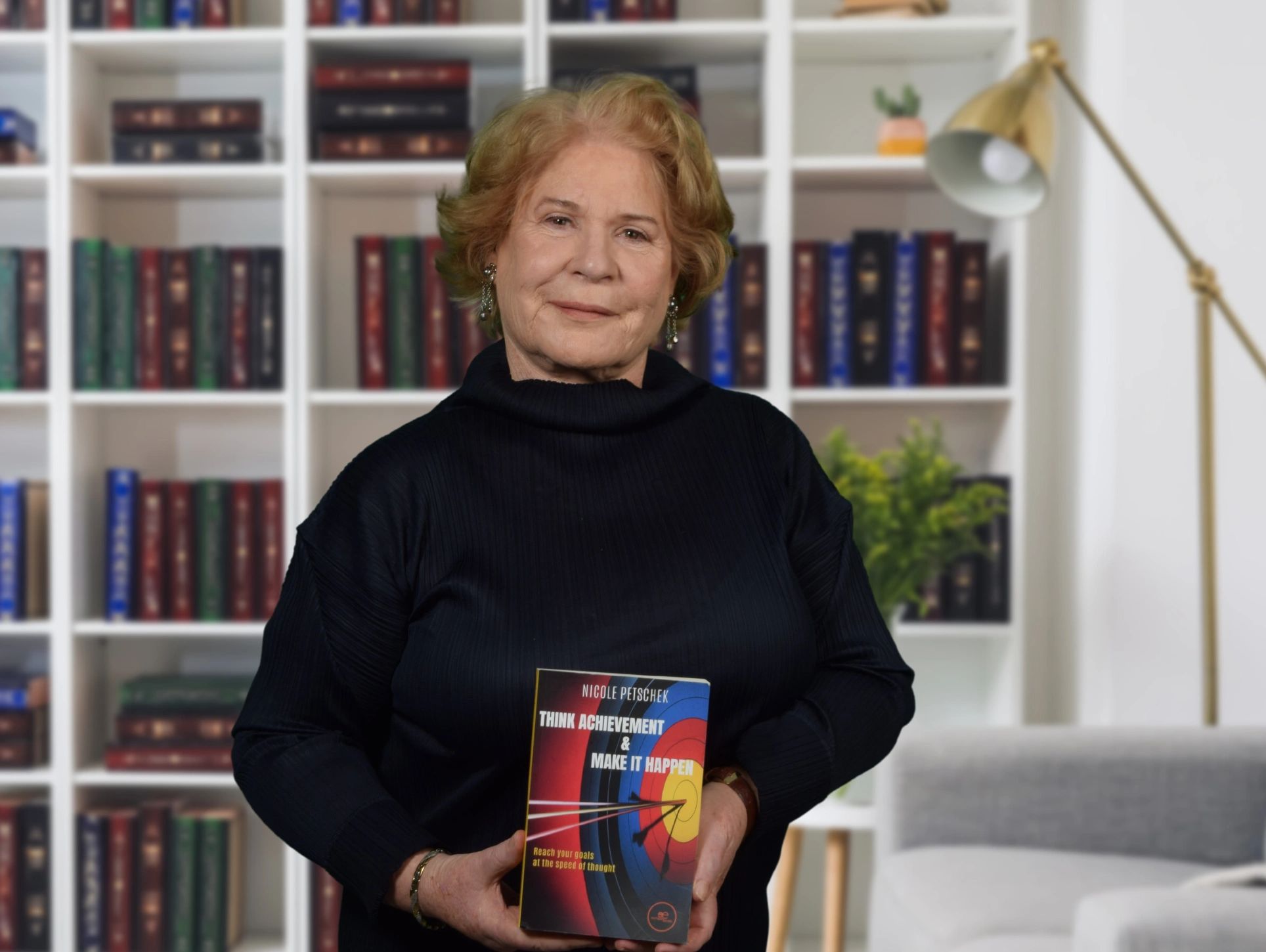 Nicole Petschek with his book