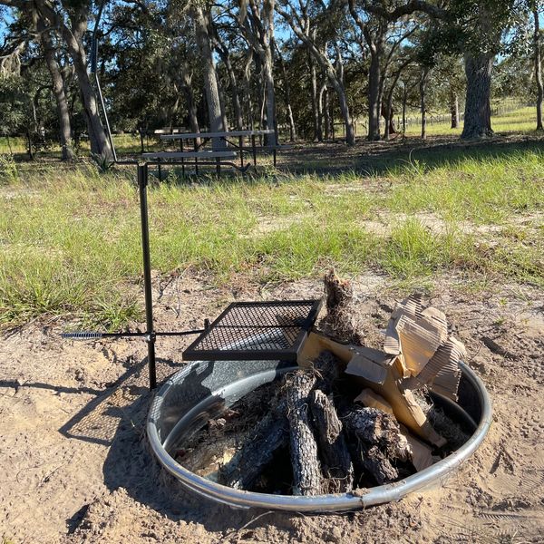 Fire pit with campsite in the background