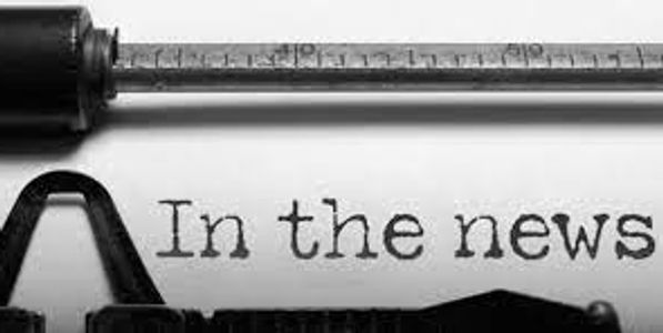 Close-up of a typewriter typing 'In the news'.