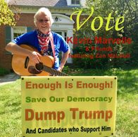 This picture shows me with my guitar standing behind a sign the presents the following statements: E