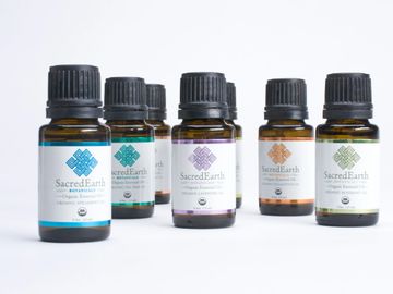Sacred Earth aromatherapy essential oil bottles. Lavender, peppermint, orange, etc.