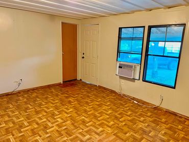 Living Room View of Entrance and Bathroom Door
