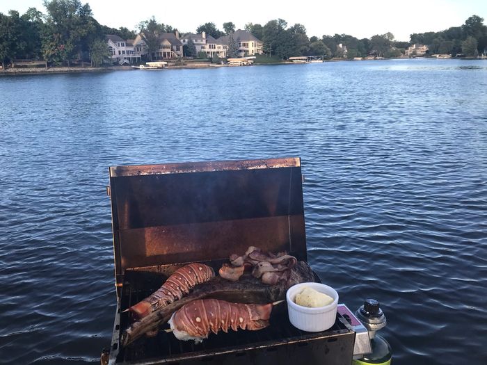 Lobster tails and tomohawk steaks. The boy grillers enjoying another day on the lake.