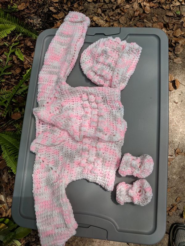 Crochet cap, sweater, and booties
