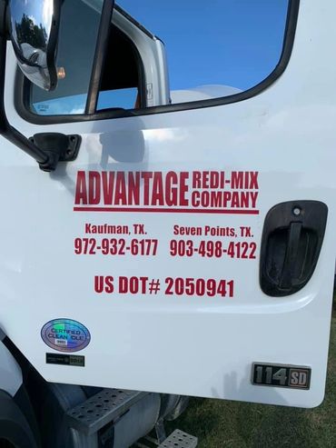 Truck door with Advantage Redi-Mix Company logo and contact information in Texas.